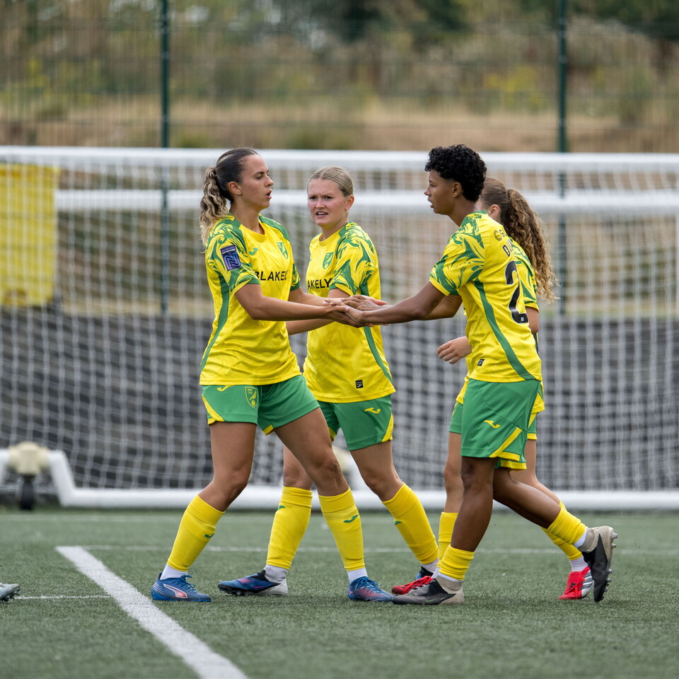 Women's team celebrate scoring at The Nest