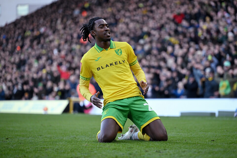 Paris Maghoma celebrates scoring against West Brom at Carrow road with a knee slide