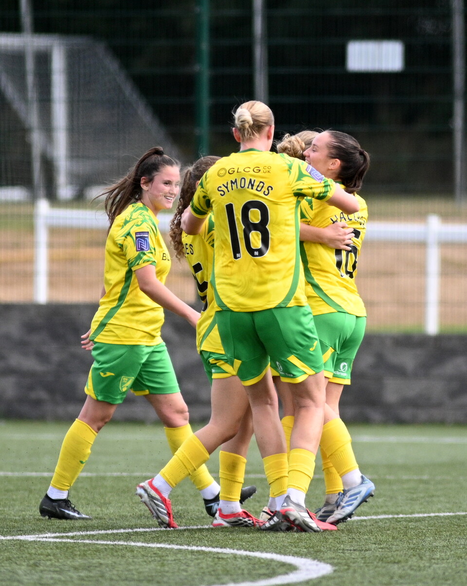 Norwich City Women celebrate after scoring against Huddersfield Town