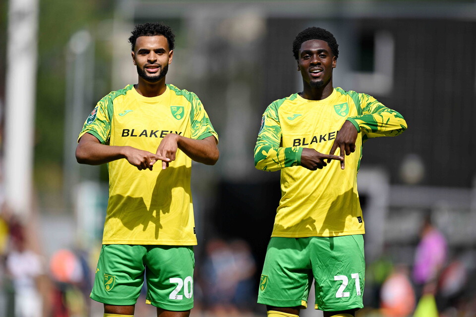 Anis Ben Slimane and Mo Toure celebrate their goals against MK Dons