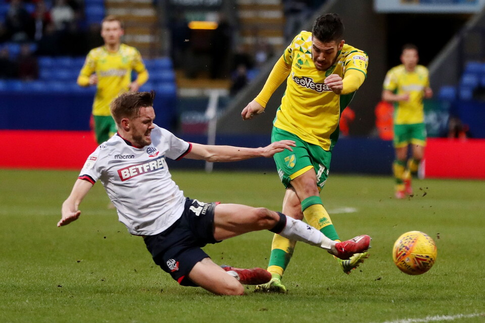 Emi Buendia is tackled during a match against Bolton Wanderers