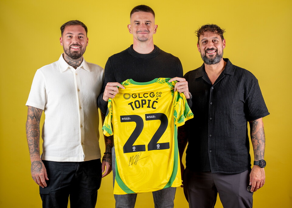 Norwich City players pose for pictures with the club partners