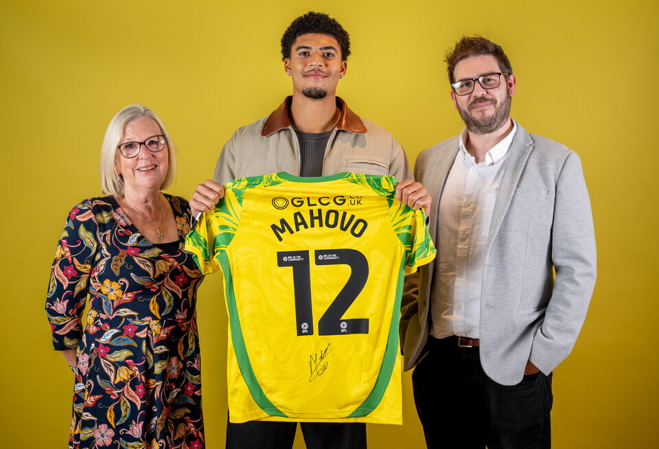 Norwich City players pose for pictures with the club partners