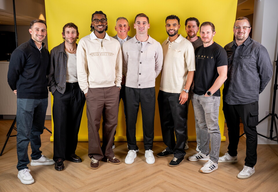 Norwich City players pose for pictures with the club partners