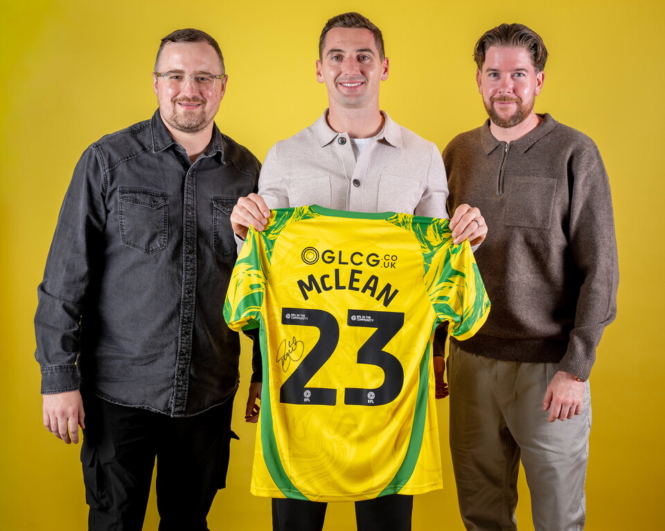 Norwich City players pose for pictures with the club partners