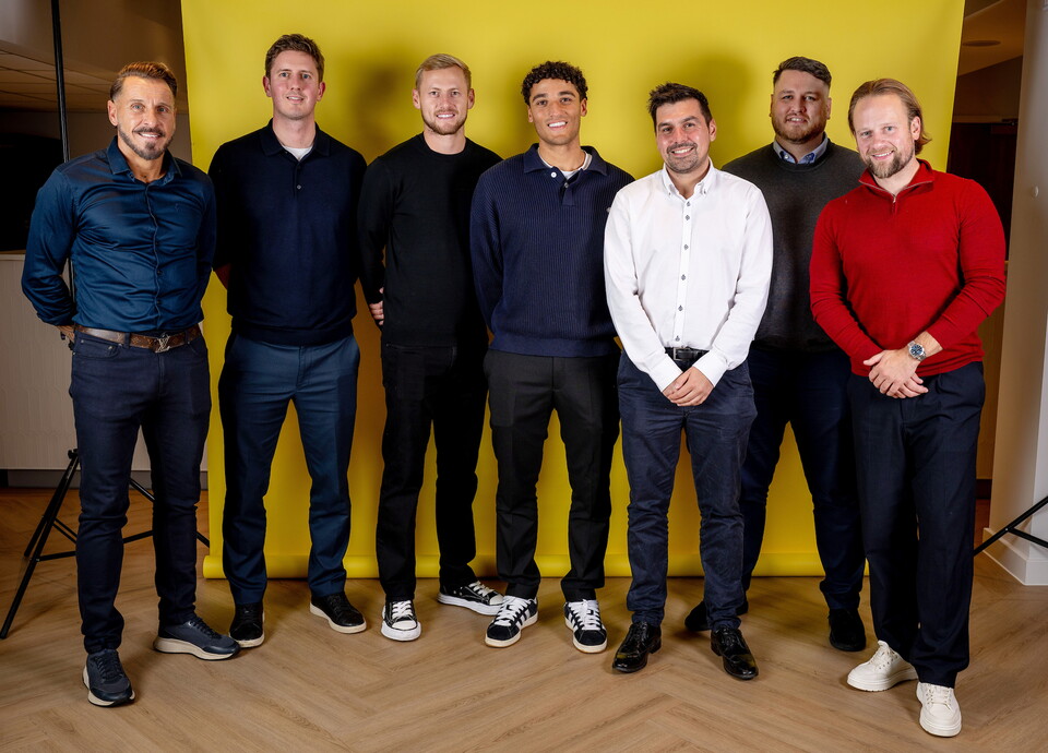 Norwich City players pose for pictures with the club partners