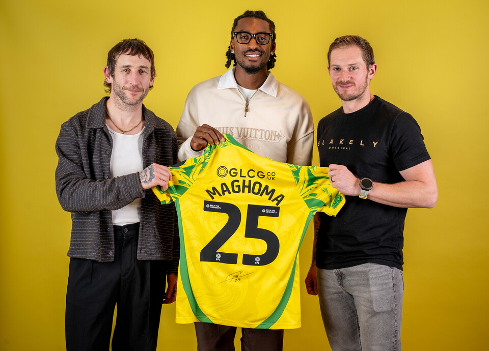 Norwich City players pose for pictures with the club partners