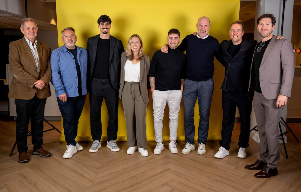 Norwich City players pose for pictures with the club partners