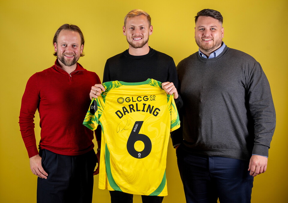 Norwich City players pose for pictures with the club partners