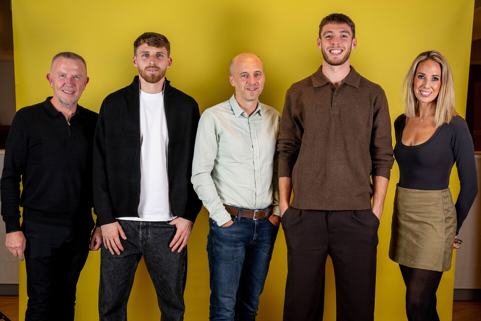Norwich City players pose for pictures with the club partners