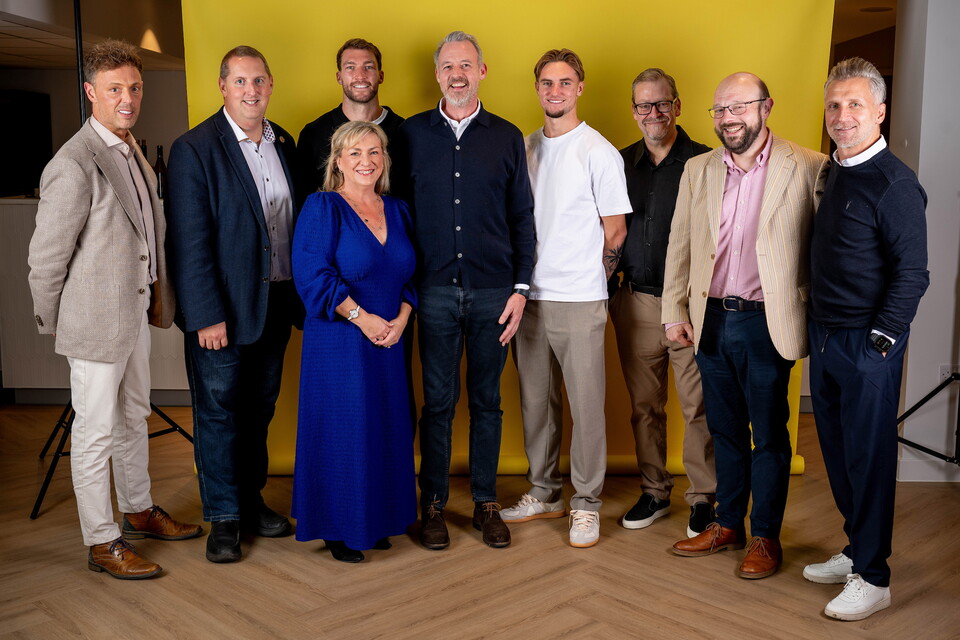 Norwich City players pose for pictures with the club partners