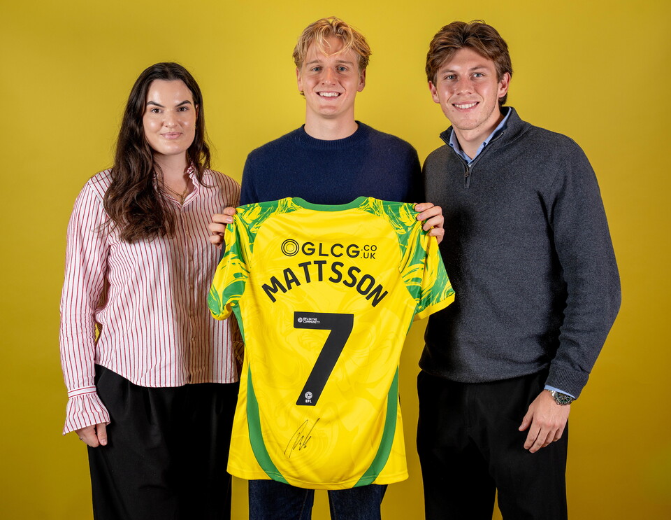 Norwich City players pose for pictures with the club partners