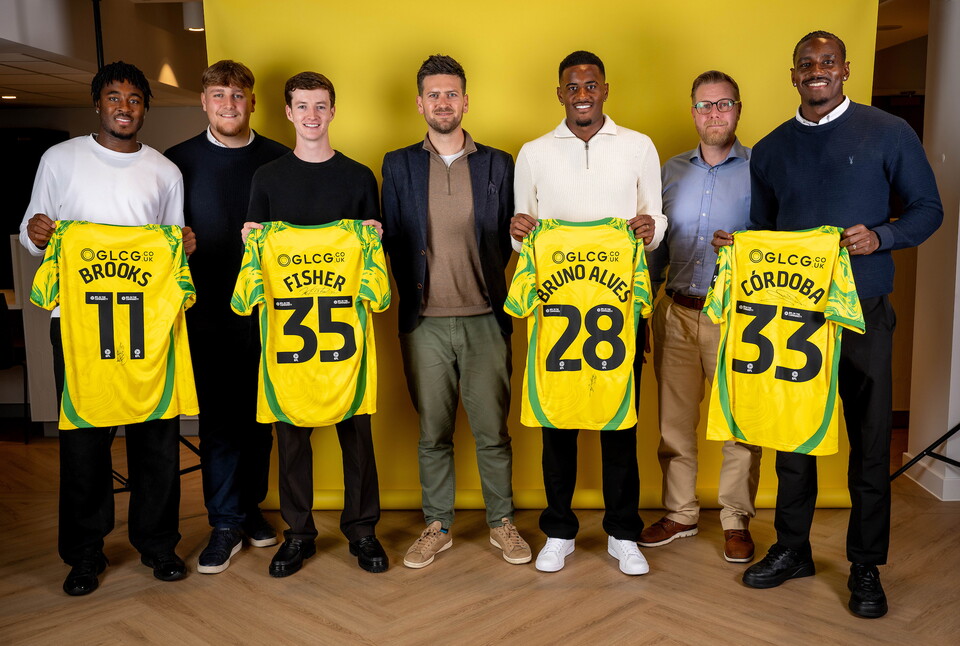 Norwich City players pose for pictures with the club partners
