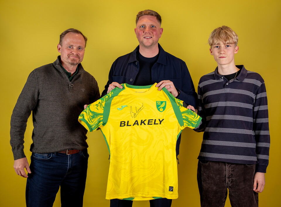 Norwich City players pose for pictures with the club partners