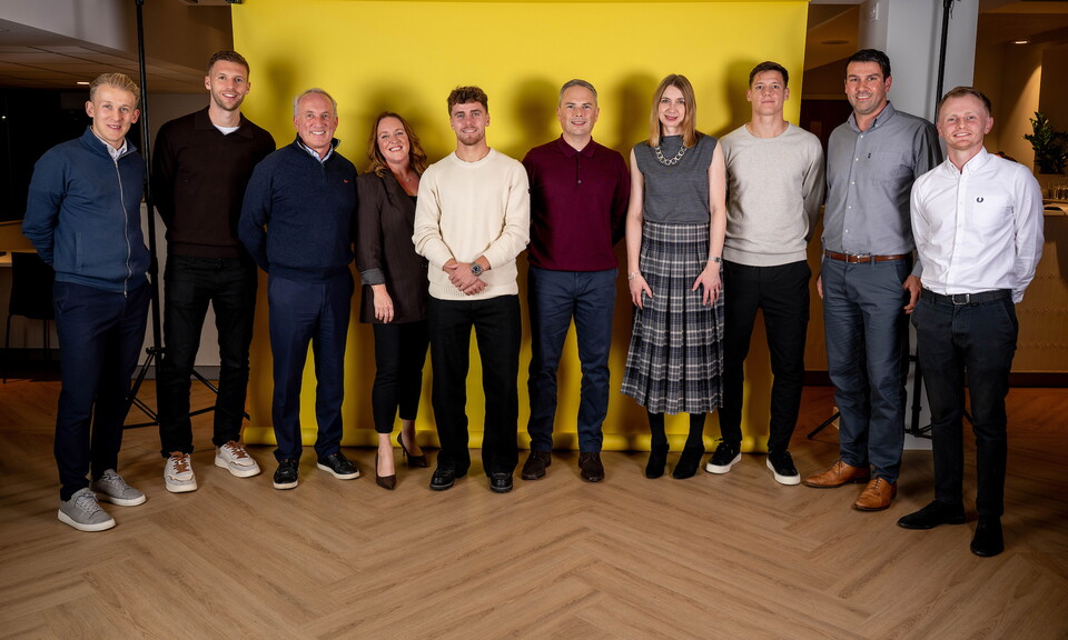 Norwich City players pose for pictures with the club partners