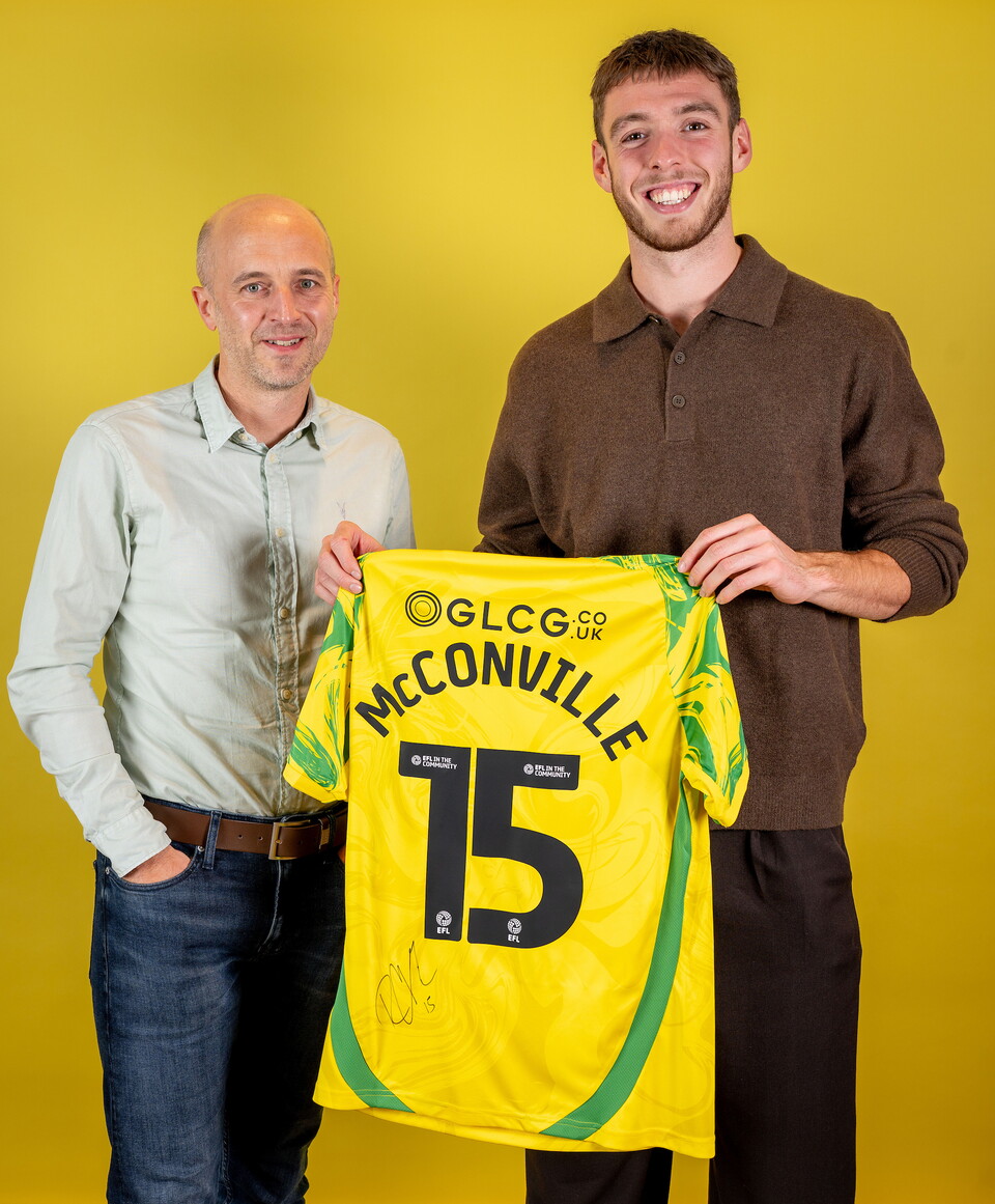 Norwich City players pose for pictures with the club partners