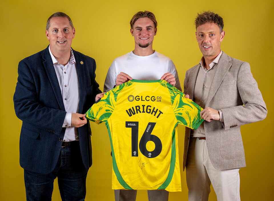Norwich City players pose for pictures with the club partners