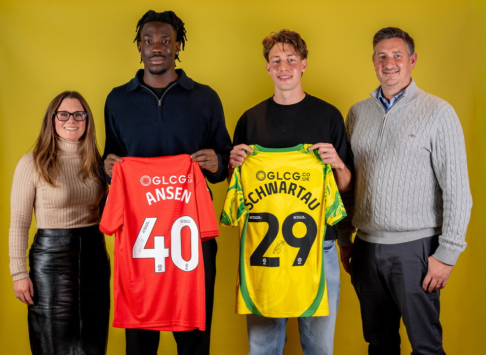 Norwich City players pose for pictures with the club partners
