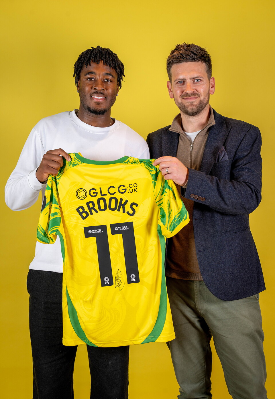 Norwich City players pose for pictures with the club partners