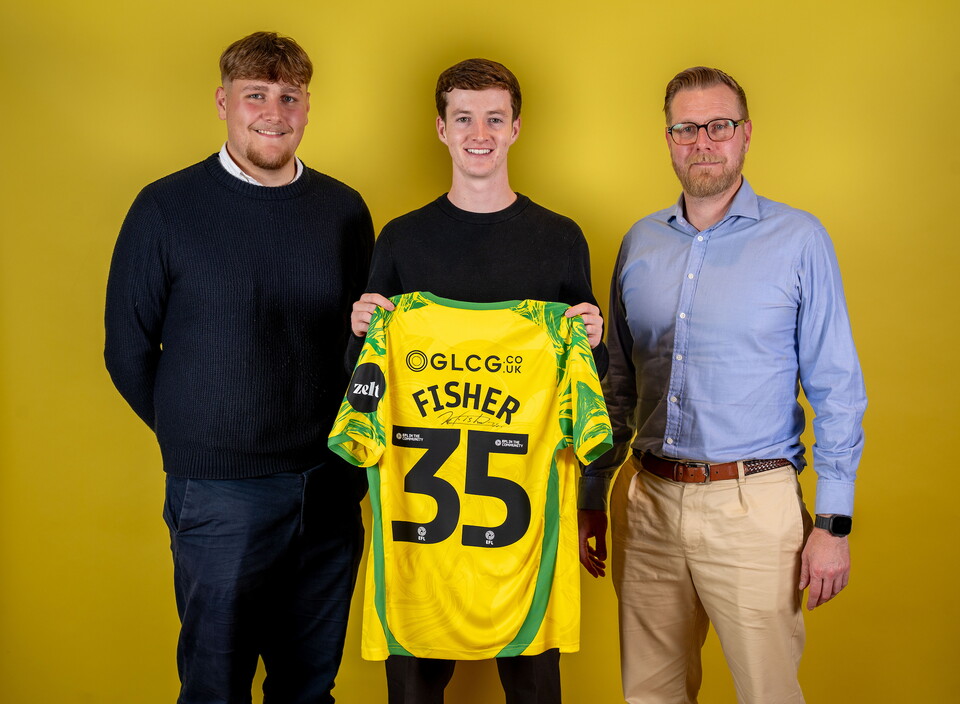 Norwich City players pose for pictures with the club partners