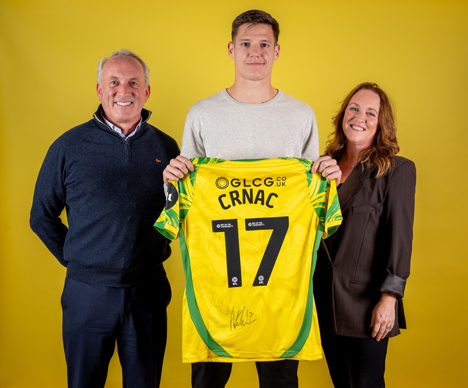Norwich City players pose for pictures with the club partners