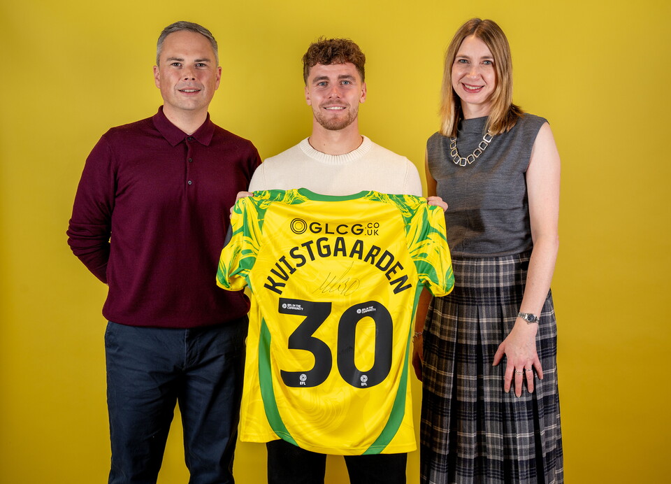 Norwich City players pose for pictures with the club partners
