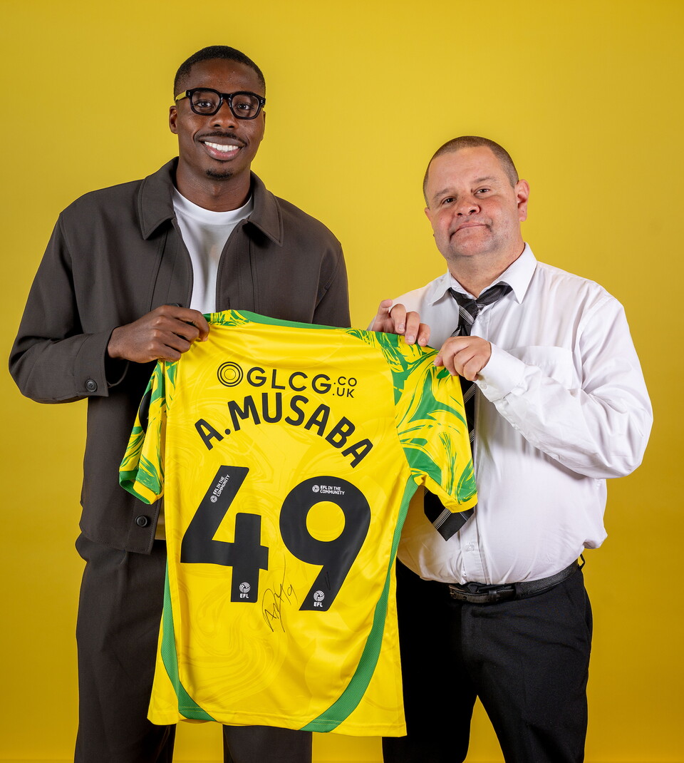 Norwich City players pose for pictures with the club partners