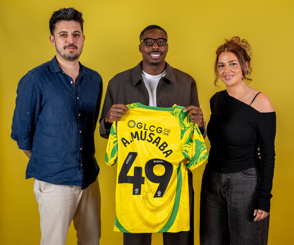 Norwich City players pose for pictures with the club partners