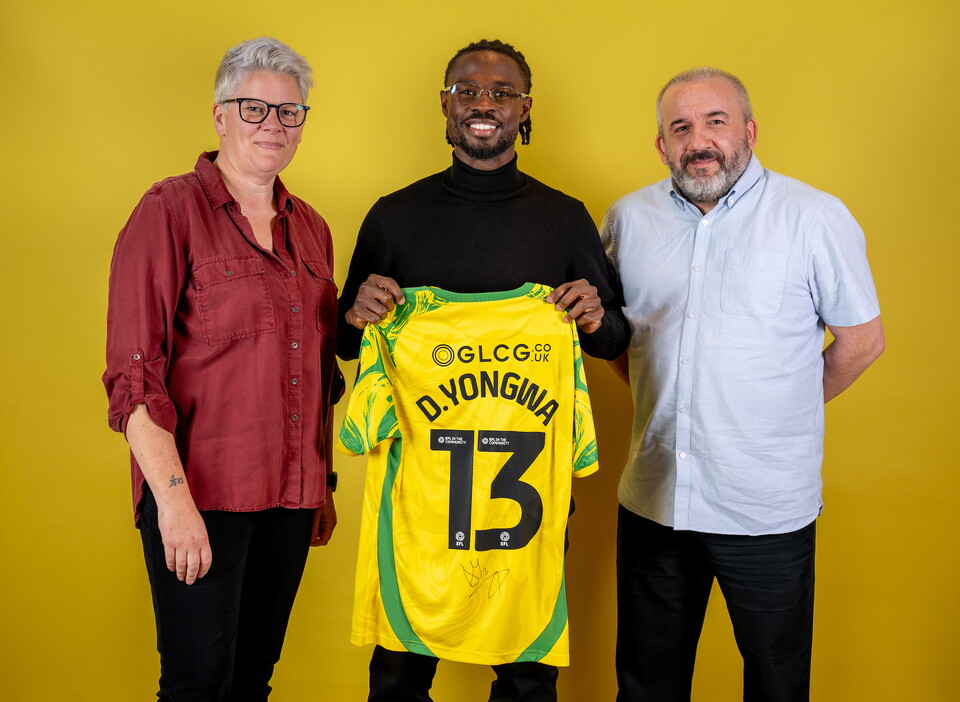 Norwich City players pose for pictures with the club partners