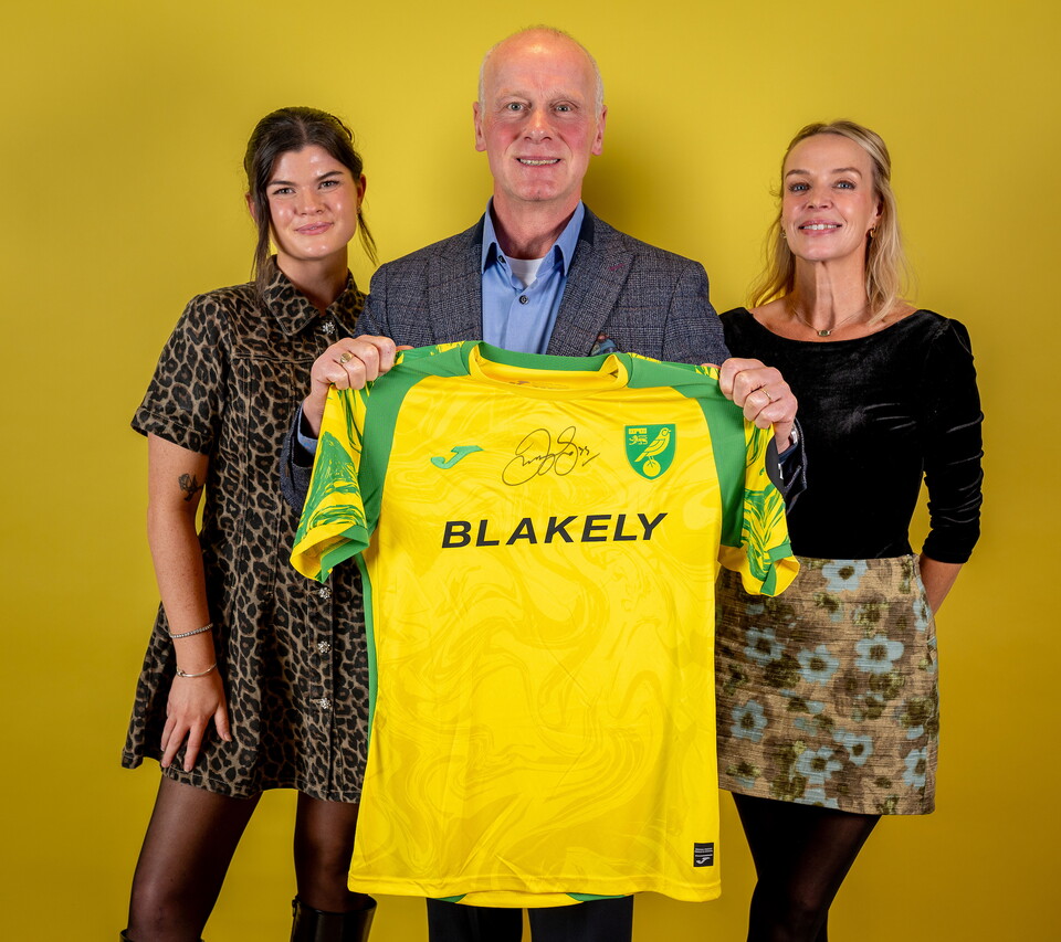 Norwich City players pose for pictures with the club partners