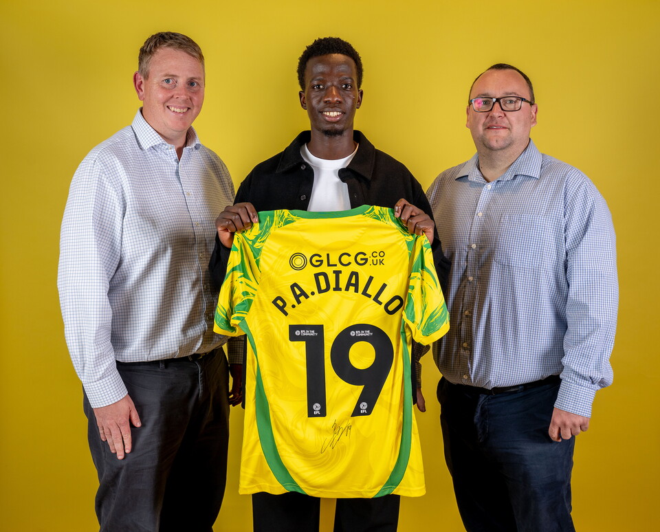 Norwich City players pose for pictures with the club partners