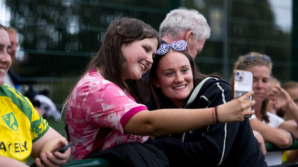 Emily Wallace poses with a fan