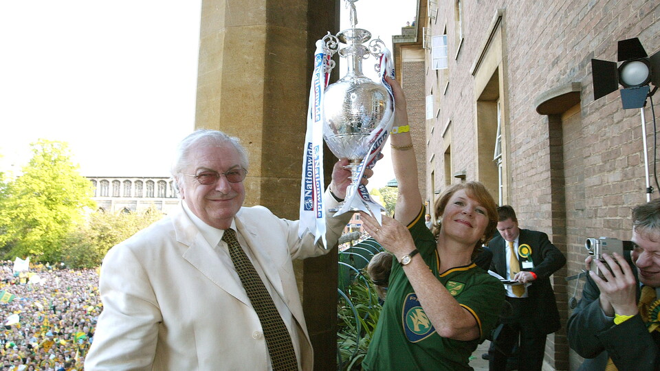 Michael and Delia lift the trophy
