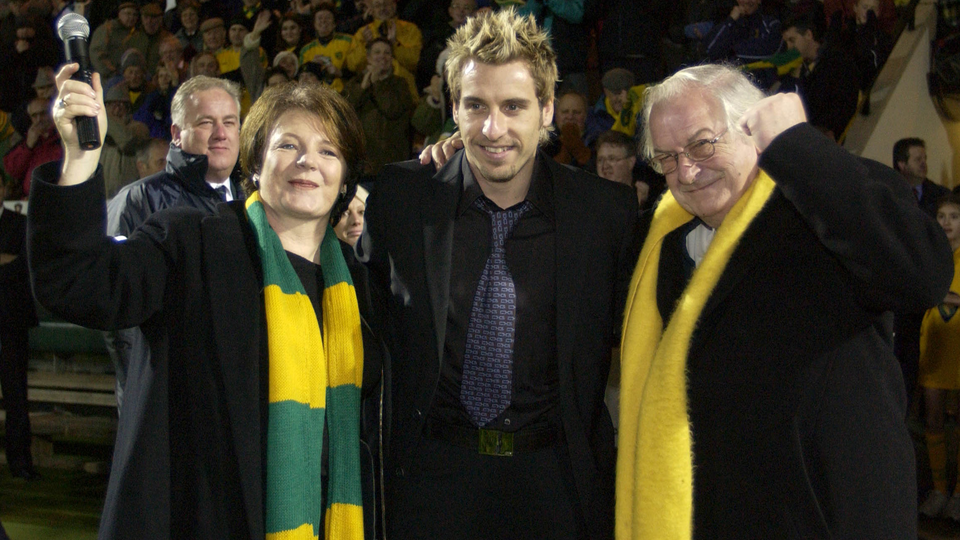 Michael Wynn Jones, Delia Smith and Darren Huckerby on the pitch at Carrow Road