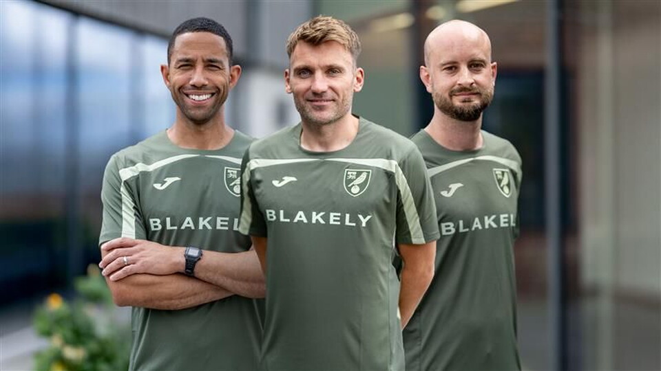 Norwich City have added Chris Hogg, James Krause and Ryan Garry to Liam Manning's coaching team.