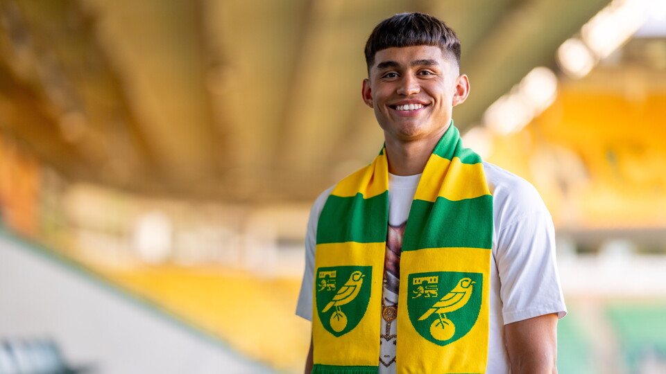 Academy midfielder Hugo Valencia Gomez has signed his first professional contract at Norwich City.