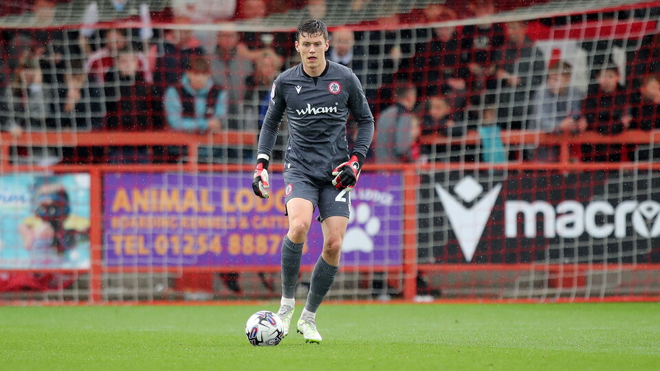 Norwich City goalkeeper Jon McCracken has extended his loan at Accrington Stanley.