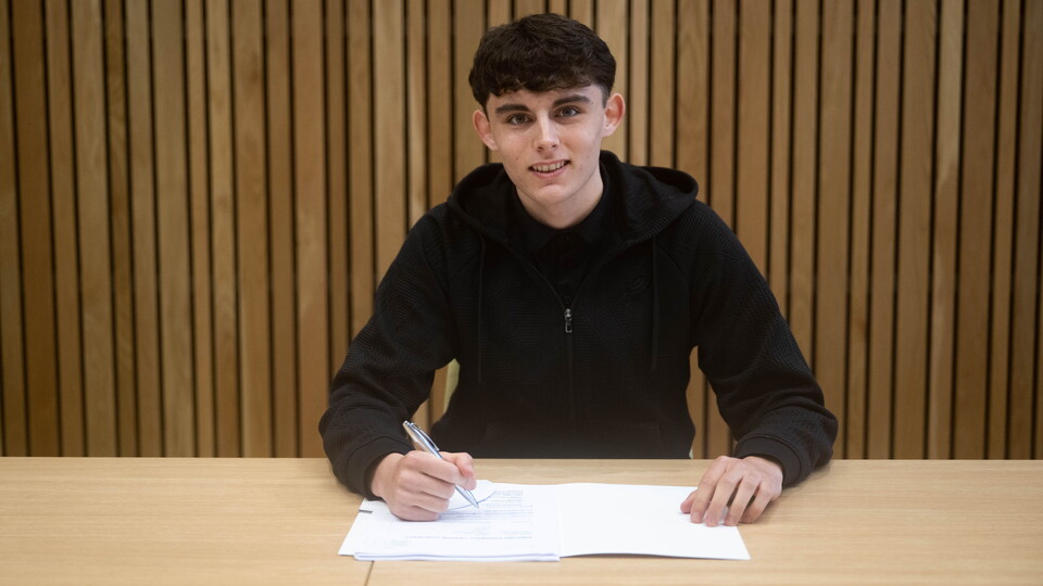 Academy player Reece Wilkes has signed his first professional contract at Norwich City.