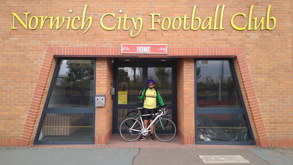 A Norwich City fan is undertaking an epic cycle challenge to raise awareness and funds for mental health and inclusivity.