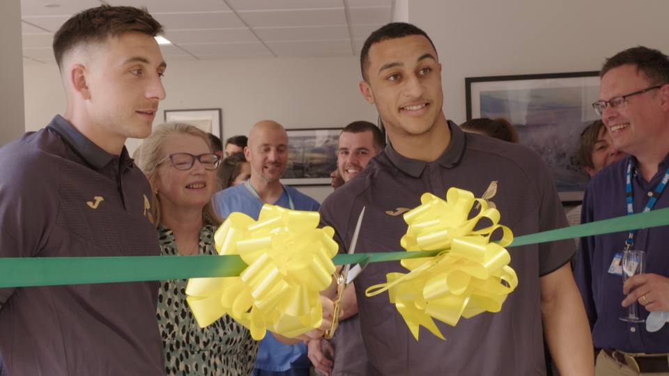 Norwich City forwards Jordan Hugill and Adam Idah were on hand to cut the ribbon at Holt Medical Practice to open a new wing at the facility on Tuesday.