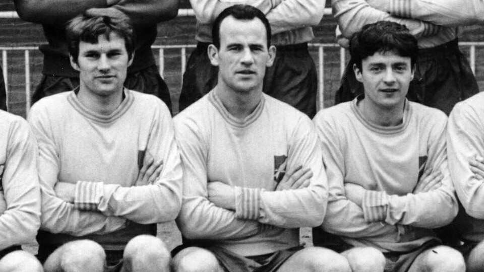 Norwich City Football Club is deeply saddened to learn of the passing of former striker Laurie Sheffield (pictured in the centre).