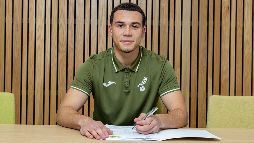 Norwich City academy defender Tyler Williams has signed his first professional contract at the club.