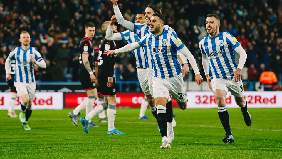 Norwich City loanee Danel Sinani was pivotal to Huddersfield Town’s 3-0 win at home to Peterborough United on Friday night.