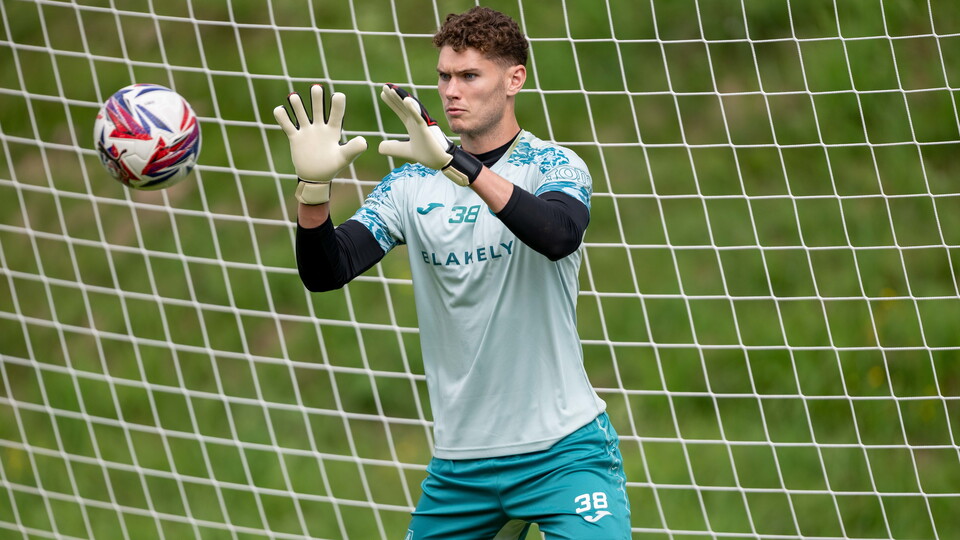 Norwich City goalkeeper Dan Barden has joined Sky Bet League Two side Swindon Town on a season-long loan.