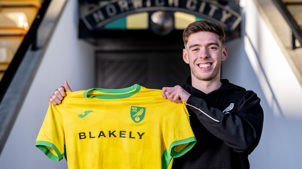 Norwich City have completed the signing of central defender Ruairi McConville from Premier League side Brighton & Hove Albion.