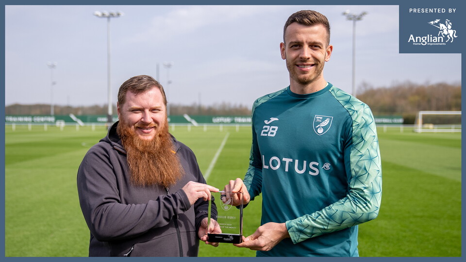 The Anglian Home Improvements Player of the Month trophy for March was presented to Angus Gunn recently by Norwich City supporter Gaz Hornagold.