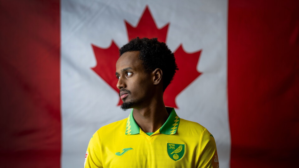 Norwich City have completed the signing of Canadian international Ali Ahmed from MLS club Vancouver Whitecaps.