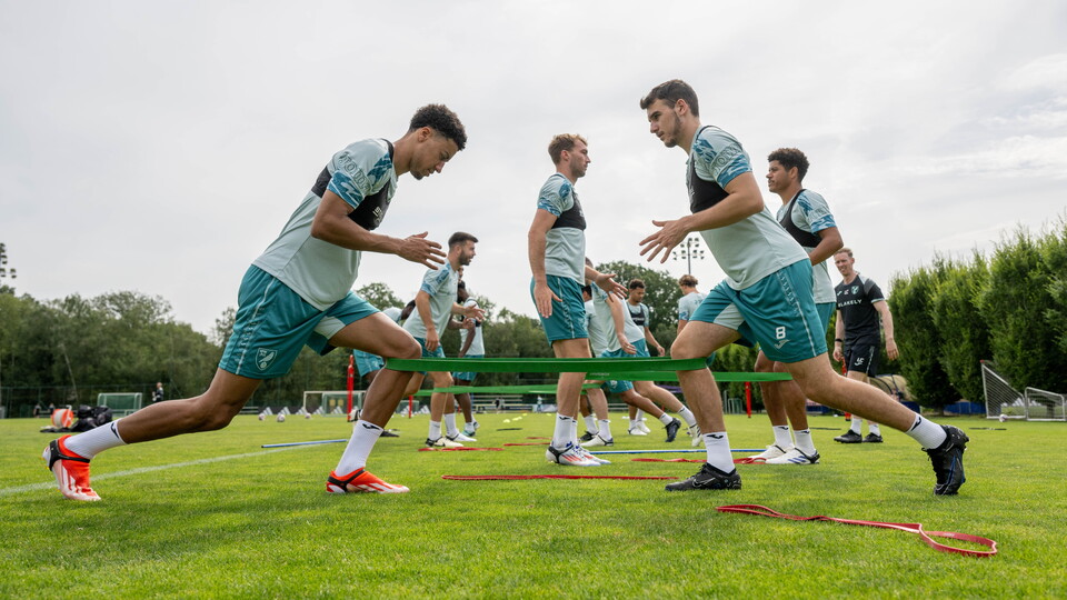 Norwich City players are put through their paces in a warm Liège ahead of their friendly against Standard de Liège.